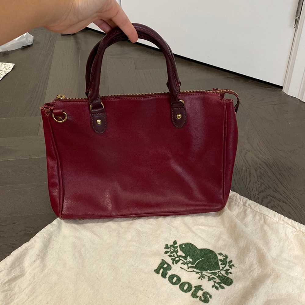 ROOTS Saffiano Leather Crossbody Bag in Ruby